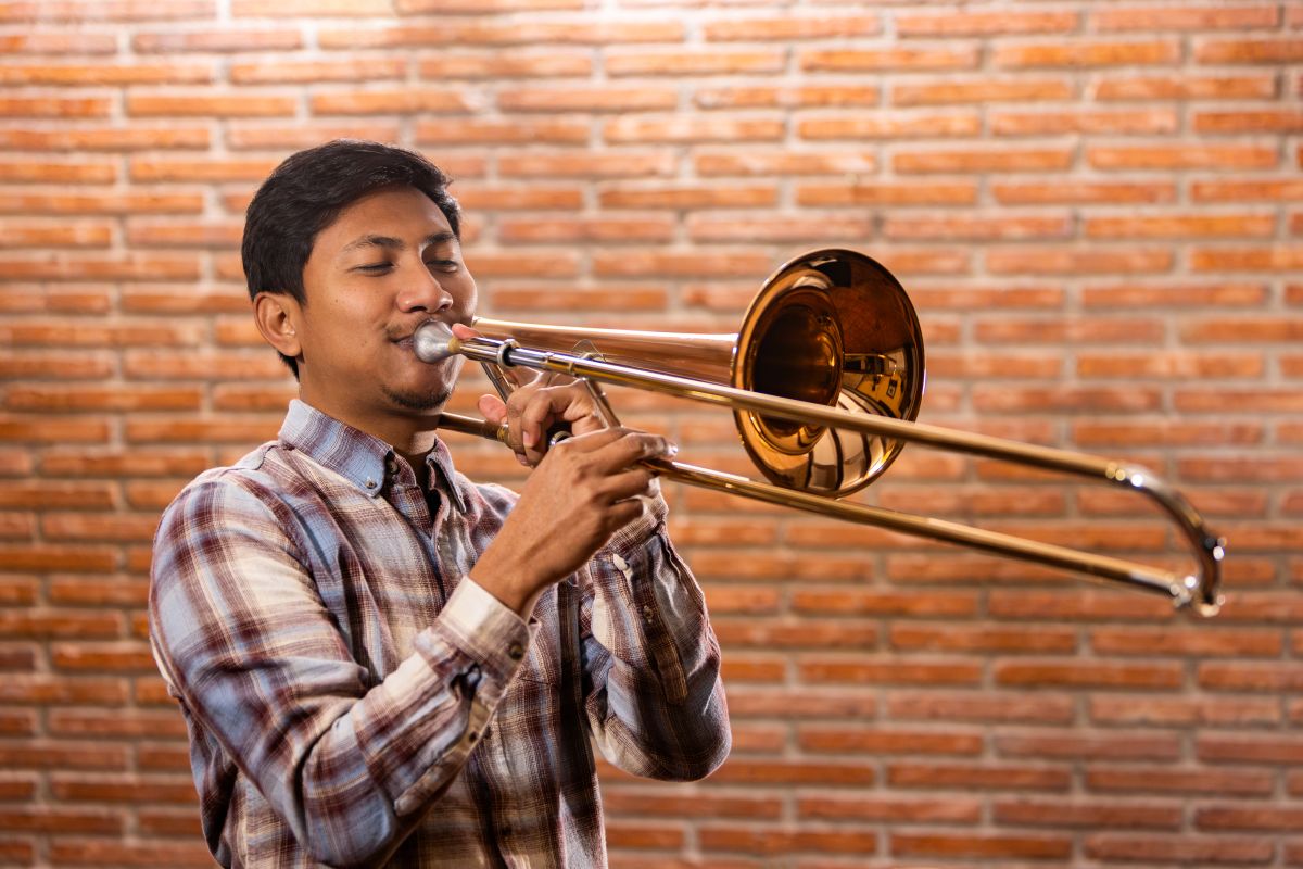 Teenager playing the trombone